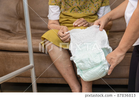 Urinary Incontinence in elderly and changing diaper. Urinary Incontinence in elderly and changing diaper. 87836813