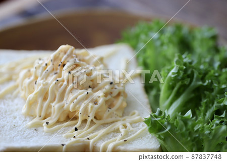 Egg salad open sandwich with topping bread 87837748