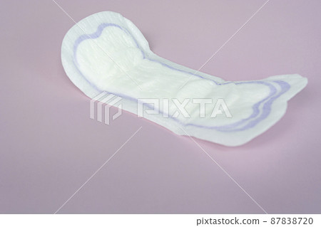 Woman hygiene protection. Sanitary pads on purple background top view. 87838720