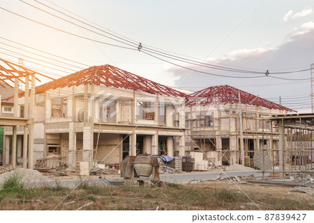 construction residential new house in progress at building site construction residential new house in progress at building site 87839427