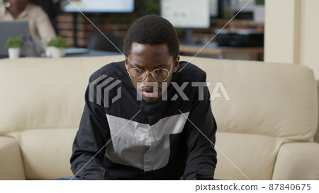 Male employee planning financial review with charts and slaes statistics, using laptop to create development presentation. Young businessman working on executive project. Close up. 87840675