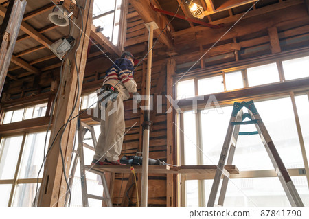 Home remodeling site working carpenter Home remodeling site working carpenter 87841790