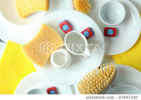 Concept of Dishwashing detergent accessories, top view Concept of Dishwashing detergent accessories, top view 87842380