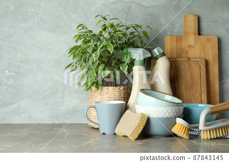 Concept of dish washing on gray textured table Concept of dish washing on gray textured table 87843145