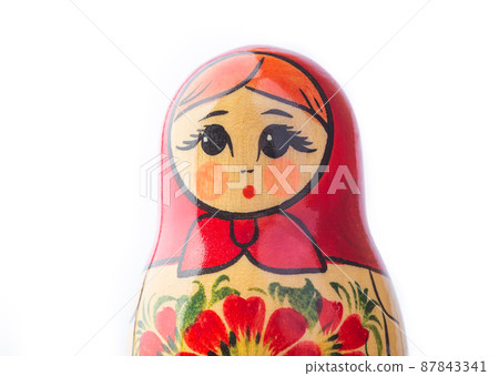 A russian matryoshka doll on a white background A russian matryoshka doll on a white background 87843341