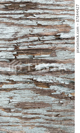Close-up background with cracked blue paint texture on gray wood Close-up background with cracked blue paint texture on gray wood 87844427