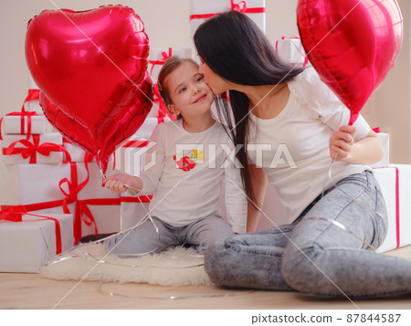 Loving mom hug little daughter express love Loving mom hug little daughter express love 87844587