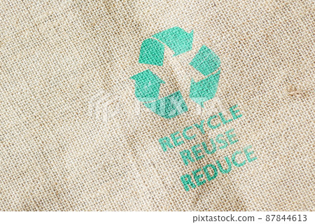 Recycled arrows sign on a shopping bag with vegetable Recycled arrows sign on a shopping bag with vegetable 87844613