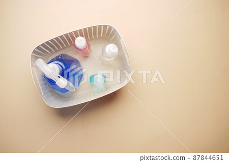 hand sanitizers in a plastic box on color background hand sanitizers in a plastic box on color background 87844651