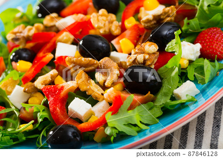 Arugula salad with vegetables, soft cheese, strawberry Arugula salad with vegetables, soft cheese, strawberry 87846128
