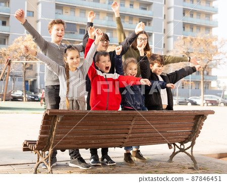 Portrait of happy kids standing together on playground in spring day Portrait of happy kids standing together on playground in spring day 87846451