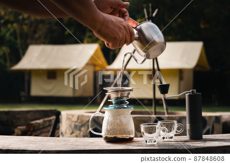 Drip coffee device outdoor place. Used in camping 87848608