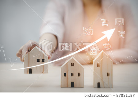 Businesswoman and mini wood house model and wood cubes of business from model on wood table, Planning buy Real Estate, Planning to buy property. Home insurance and security ideas concept. Businesswoman and mini wood house model and wood cubes of business from model on wood table, Planning buy Real Estate, Planning to buy property. Home insurance and security ideas concept. 87851187