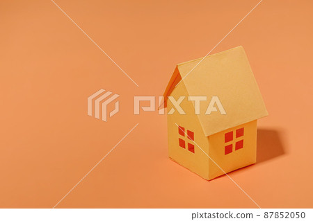 Orange paper house with copy space. Orange paper house with copy space. 87852050