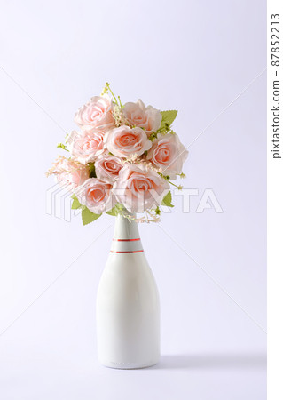 Bouquet of chic pink flowers in a champagne bottle Bouquet of chic pink flowers in a champagne bottle 87852213