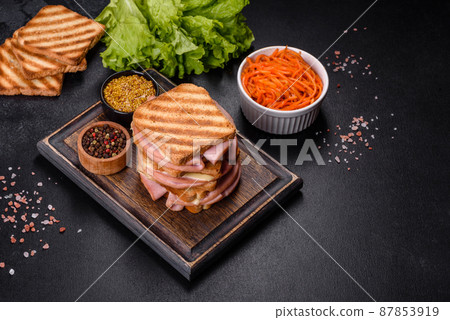 Delicious fresh toast grill with cheese and ham. Sandwiches, quick snack Delicious fresh toast grill with cheese and ham. Sandwiches, quick snack 87853919