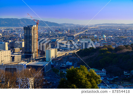 Panorama scenery around Kumamoto station (sunset light beam scenery) 87854418