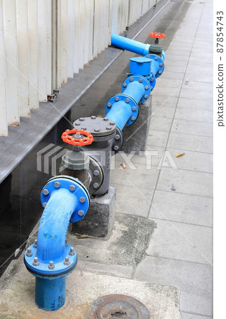 Water valve near concrete wall, Water pipes joined with water supply valves system on street. Water valve near concrete wall, Water pipes joined with water supply valves system on street. 87854743