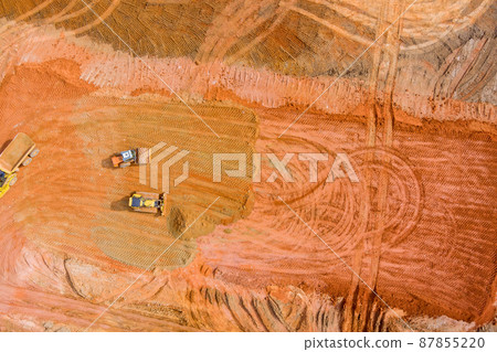 Excavator during earthmoving at open pit on construction earthmoving heavy equipment for excavation loading 87855220