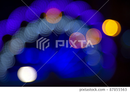 Colored blurred bokeh. abstract background of included festive garlands. colorful blur light bulbs Colored blurred bokeh. abstract background of included festive garlands. colorful blur light bulbs 87855563