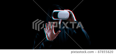 Vr goggles virtual reality blured. Young man in digital helmet for 3d virtual reality game on dark background. Study and virtual world in 3D simulation with glitch effect. Vr goggles virtual reality blured. Young man in digital helmet for 3d virtual reality game on dark background. Study and virtual world in 3D simulation with glitch effect. 87855820