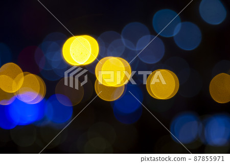Colored blurred bokeh. abstract background of included festive garlands. colorful blur light bulbs Colored blurred bokeh. abstract background of included festive garlands. colorful blur light bulbs 87855971