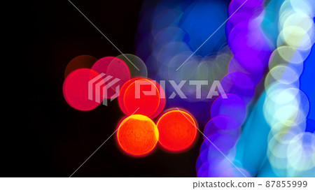 Colored blurred bokeh. abstract background of included festive garlands. colorful blur light bulbs Colored blurred bokeh. abstract background of included festive garlands. colorful blur light bulbs 87855999