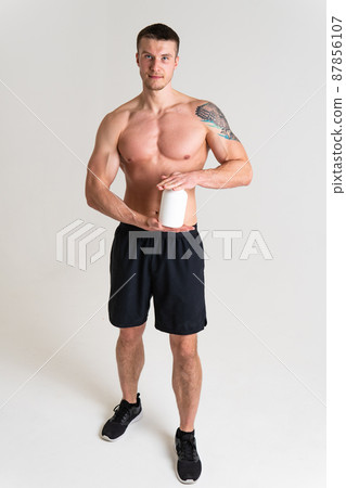 Fitness protein jars white on white background bodybuilder powder strong high pain hurt painful, person white background stress, hand Touching care, lower suffer attractive Fitness protein jars white on white background bodybuilder powder strong high pain hurt painful, person white background stress, hand Touching care, lower suffer attractive 87856107