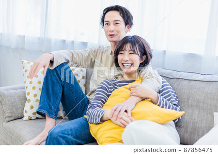 A good friend couple relaxing on the sofa 87856475