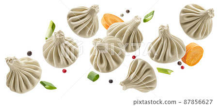Falling khinkali, frozen dumplings isolated on white background Falling khinkali, frozen dumplings isolated on white background 87856627