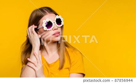 Girl in stylish sunglasses Girl in stylish sunglasses 87856944