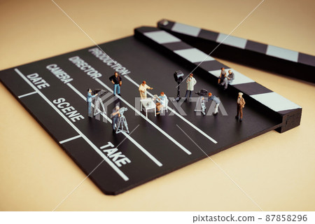Movie filming scene. Figurines on clapboard 87858296