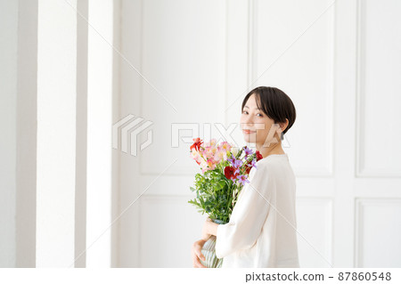 A woman holding a bouquet A woman holding a bouquet 87860548