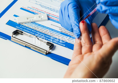 Healthcare professional performing Coronavirus COVID-19 rapid testing Healthcare professional performing Coronavirus COVID-19 rapid testing 87860602