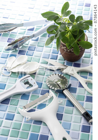 Blue tiles and kitchen tools 87864143