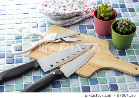 Blue tiles and kitchen tools 87864150