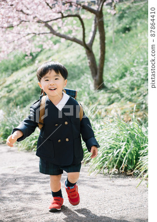 Spring cherry blossoms and uniform kindergarten children Spring cherry blossoms and uniform kindergarten children 87864410