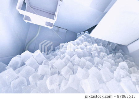 A large amount of ice cubes in the ice dispenser A large amount of ice cubes in the ice dispenser 87865513