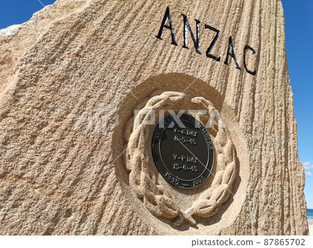 Surfers Paradise Esplanade ANZAC War Memorial Stone with the shape looks like a fin and the text 'Lest We Forget'. 87865702