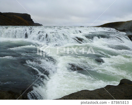 The magnificent Gullfoss Falls that splash water in the Golden Circle, Iceland 87865813