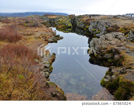 A rift in the continental plate at Sinkvelittle National Park in the Golden Circle, Iceland A rift in the continental plate at Sinkvelittle National Park in the Golden Circle, Iceland 87865824