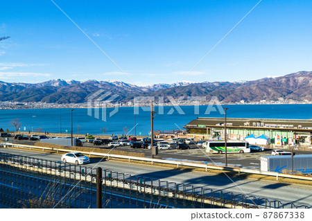 Lake Suwa and the mountains of Nagano seen from Lake Suwa SA on the Chuo Expressway in Nagano Prefecture Lake Suwa and the mountains of Nagano seen from Lake Suwa SA on the Chuo Expressway in Nagano Prefecture 87867338