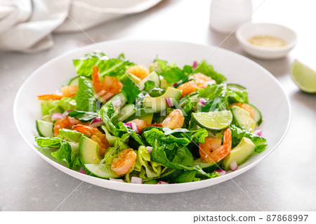 Shrimps avocado salad with cucumbers and lettuce 87868997
