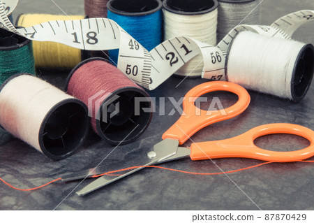 Spools of thread, tape measure and scissors. Accessories for embroidery and sewing Spools of thread, tape measure and scissors. Accessories for embroidery and sewing 87870429