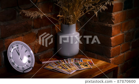 Blurred predictions background. Tarot cards layout on witch table. 87870600