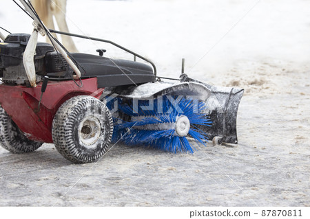 special machine for snow removal cleans the road 87870811