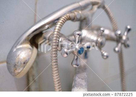 Selective focus, old rusty dirty plumbing in the bathroom close-up Selective focus, old rusty dirty plumbing in the bathroom close-up 87872225