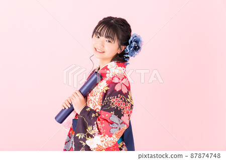 Elementary school girl wearing a hakama Elementary school girl wearing a hakama 87874748