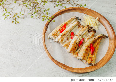 Grilled Eel on a Wood Plate 87874838
