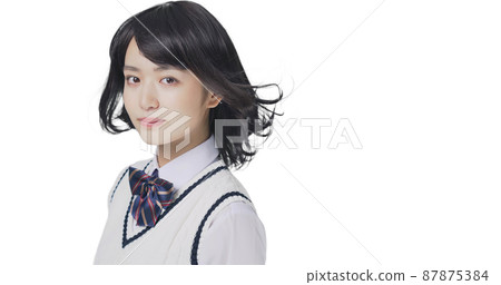 Female student with fluttering hair, high school student, examinee 87875384